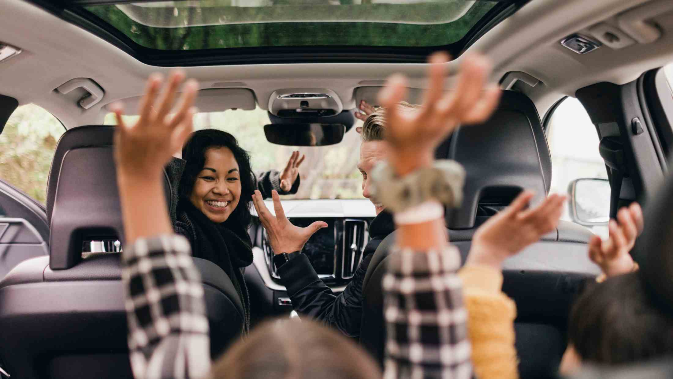 Cheerful family enjoying a road trip